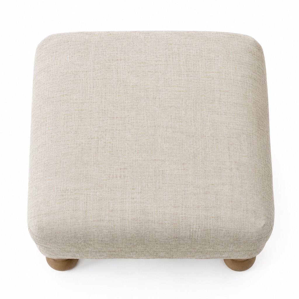 Birka oatmeal linen ottoman with oak legs in bright daylight — view 5